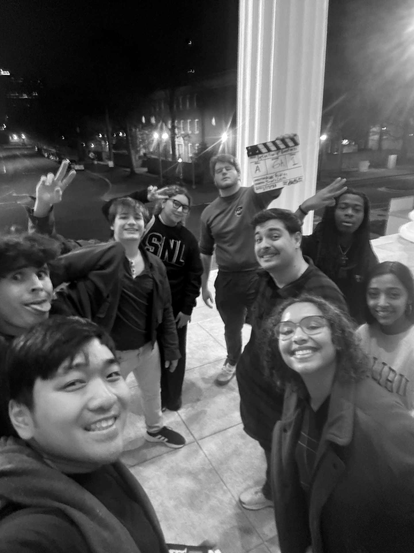 Behind the scenes — the full Reach Studio crew on a night shoot with the clapperboard