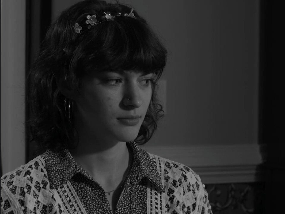 Production still from Pass The Salt — close-up portrait of the lead actress